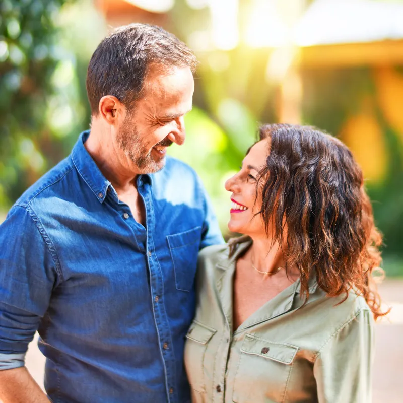 Happy couple smiling after NAD+ treatment.
