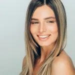 Smiling woman with refreshed, natural-looking results at Greenwich Medical Spa, showcasing the growing demand for subtle Botox results, natural filler results, conservative injectables, and regenerative aesthetics.