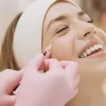 Smiling patient receiving a cosmetic injectable treatment at Greenwich Medical Spa, highlighting the expertise of a medically led med spa and why patients choose the best medical spa in Greenwich CT for safe, personalized aesthetic care.